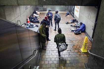 Homeless individuals sleeping underneath